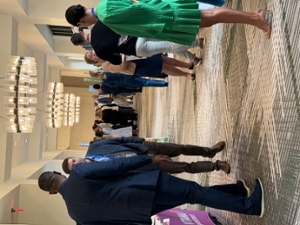 overall shot of symposium at sheraton hotel in flowood ms, different individuals standing around visiting booths